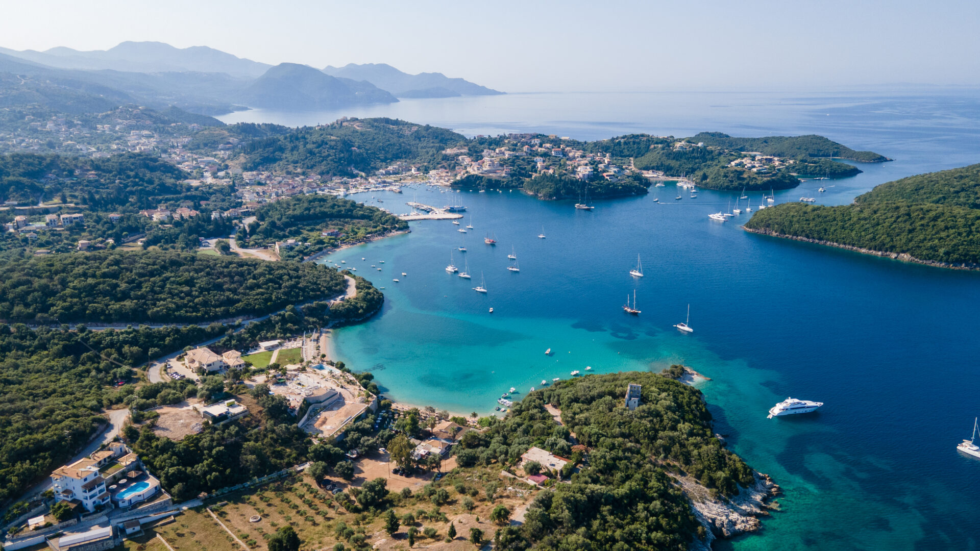 Small Yacht Trends 2026 | Owner-Operator Options | YATCO Aerial view of sandy beaches with turquoise sea in Epirus, Greece